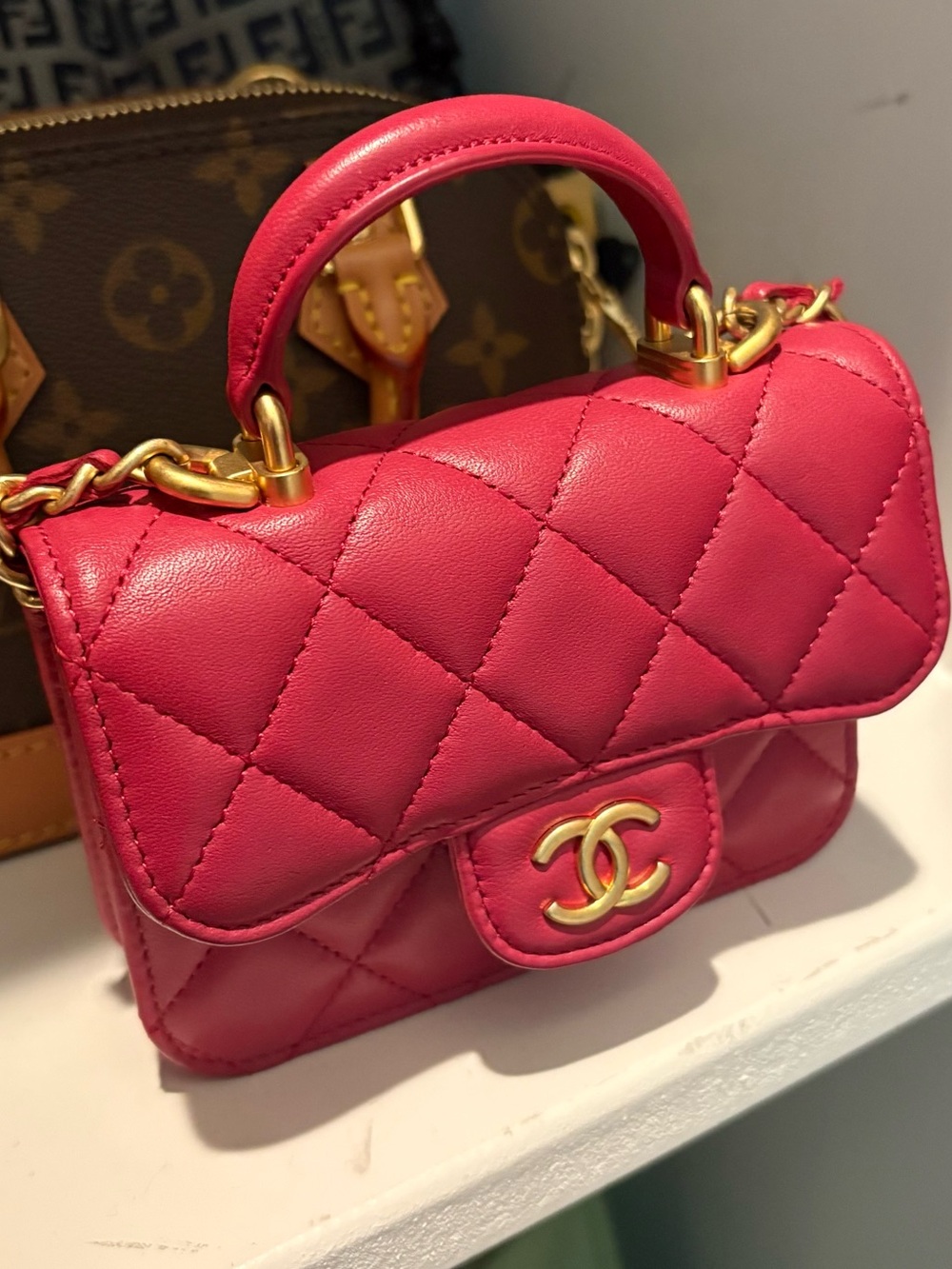 CHANEL Quilted Mini Top-Handle Bag in Vibrant Pink with Gold Hardware